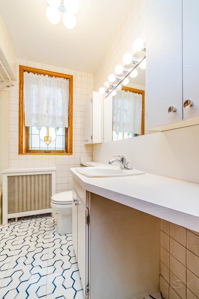 2933 Maple Avenue Berwyn, IL 60402 - Photo 13 of 49 a bathroom with a sink toilet and shower