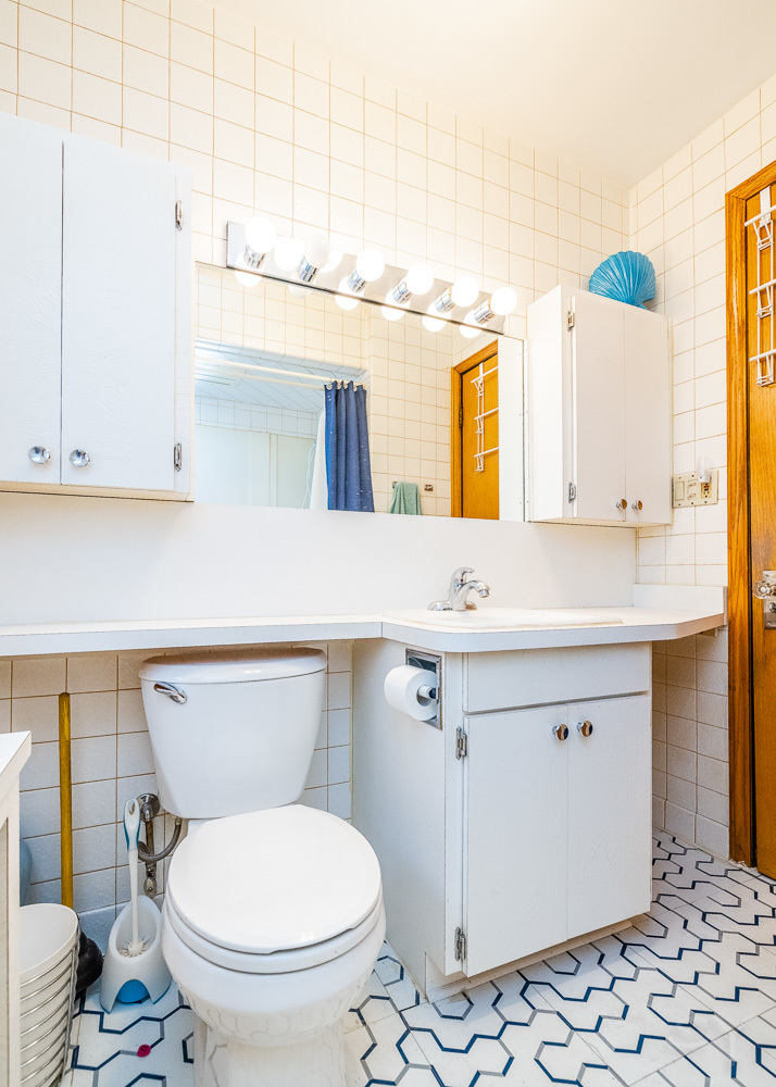 2933 Maple Avenue Berwyn, IL 60402 - Photo 16 of 49 a bathroom with a sink a toilet and mirror