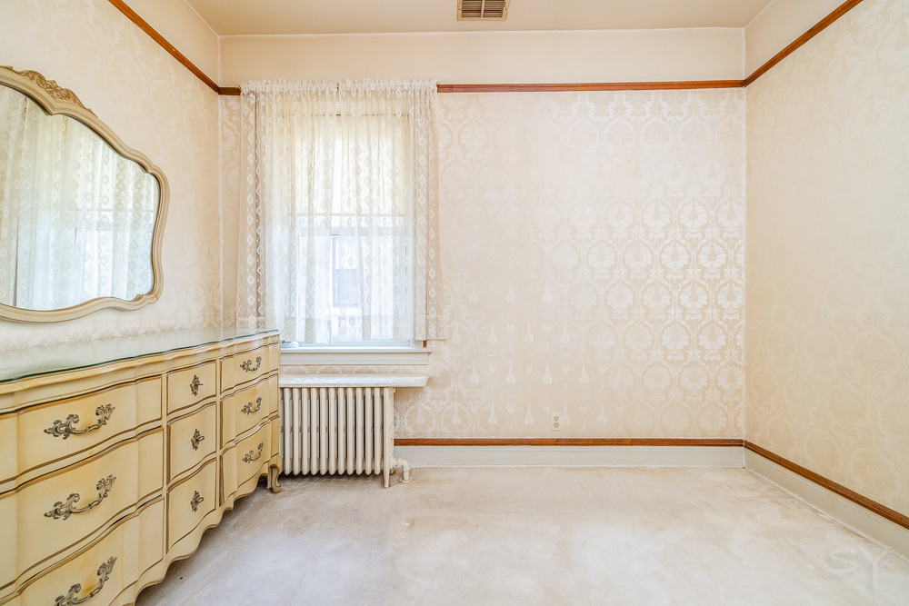 2933 Maple Avenue Berwyn, IL 60402 - Photo 21 of 49 a view of a bedroom with wooden floor and windows
