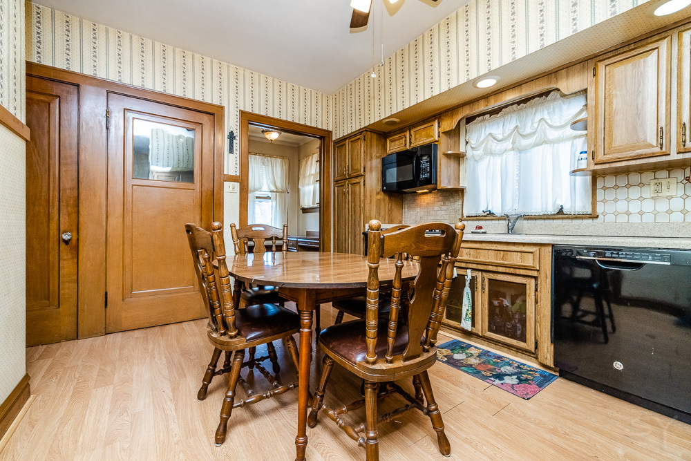 2933 Maple Avenue Berwyn, IL 60402 - Photo 27 of 49 a kitchen with a table chairs stove and cabinets