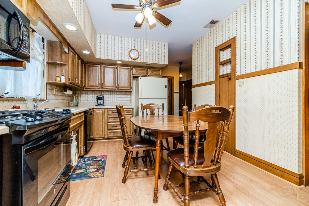 2933 Maple Avenue Berwyn, IL 60402 - Photo 31 of 49 a view of a dining room with furniture and a chandelier