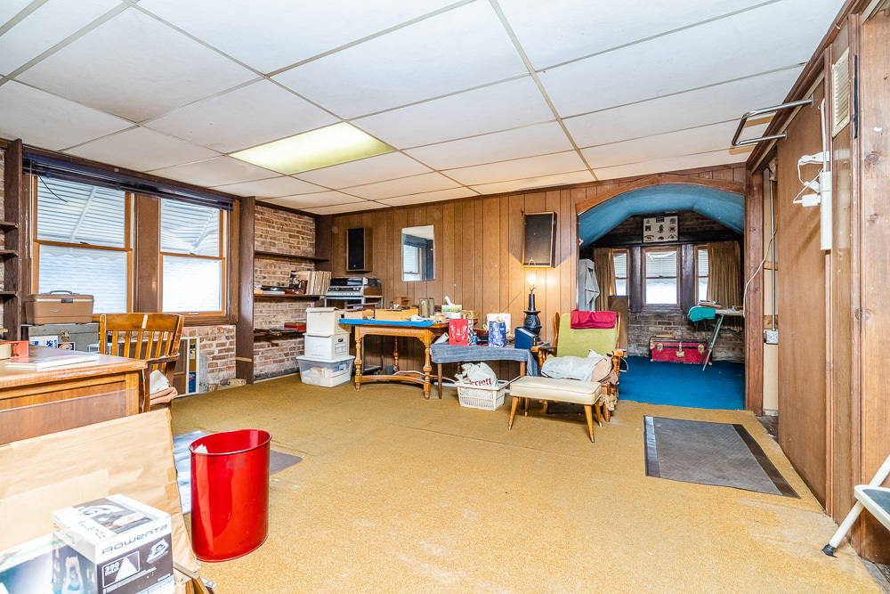 2933 Maple Avenue Berwyn, IL 60402 - Photo 34 of 49 a living room with lots of furniture and a chandelier