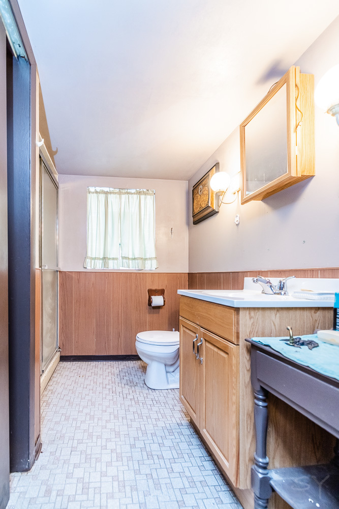 2933 Maple Avenue Berwyn, IL 60402 - Photo 39 of 49 a bathroom with a sink a toilet and mirror