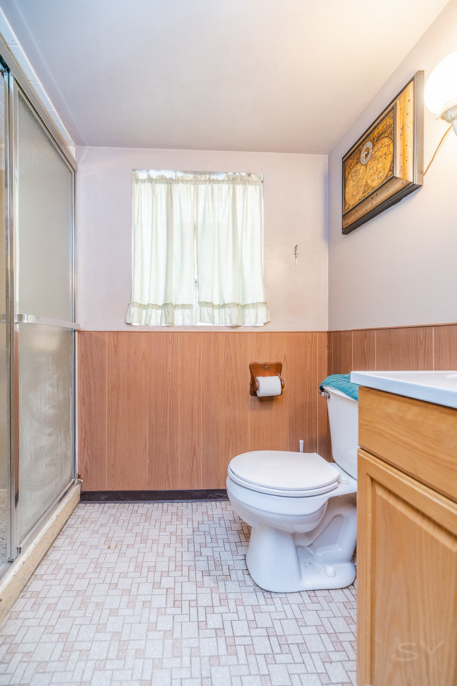 2933 Maple Avenue Berwyn, IL 60402 - Photo 40 of 49 a bathroom with a toilet a sink and a window