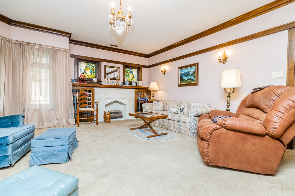 2933 Maple Avenue Berwyn, IL 60402 - Photo 4 of 49 a living room with furniture and a fireplace