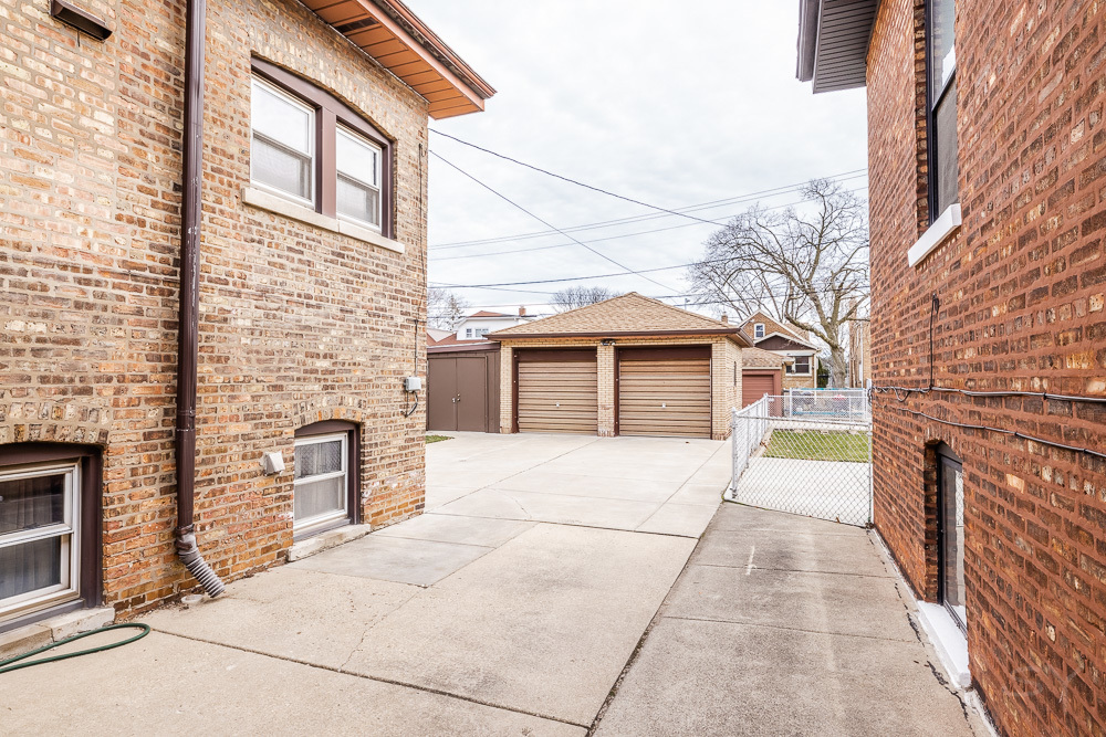 2933 Maple Avenue Berwyn, IL 60402 - Photo 46 of 49 a front view of a house with a garage