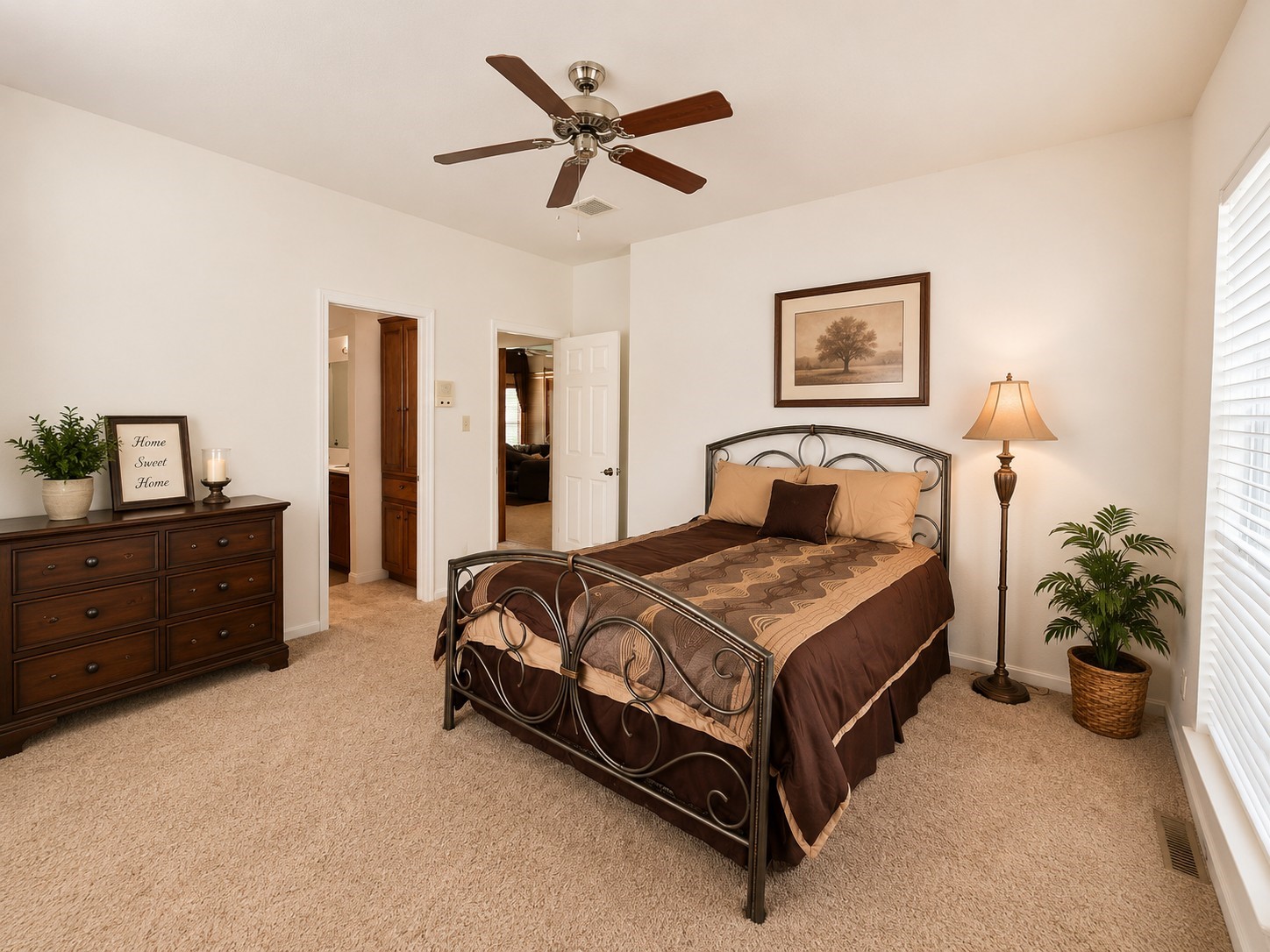 5518 Lacreek Lane Spring, TX 77379 - Photo 14 of 29 PRIMARY BEDROOM - Spacious primary retreat featuring abundant natural light, a ceiling fan, generous room for furnishings, and convenient access to the private en-suite bath.