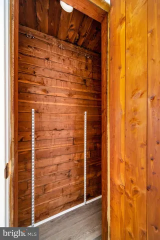 a bathroom with a shower and a door
