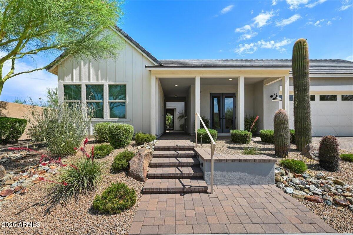 4412 East Roy Rogers Road Cave Creek, AZ 85331 - Photo 3 of 40 a view of a house with potted plants