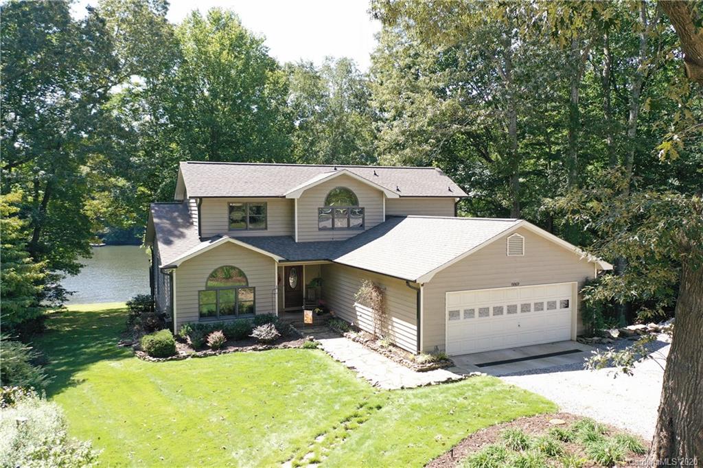 8869 Holdsclaw Road Terrell, NC 28682 - Photo 2 of 37 a view of a house with a yard garage and outdoor seating