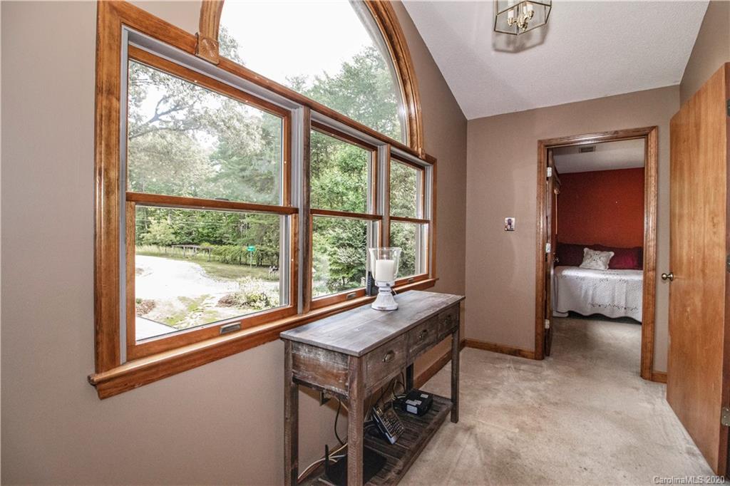 8869 Holdsclaw Road Terrell, NC 28682 - Photo 19 of 37 a bedroom with a bed and a large window