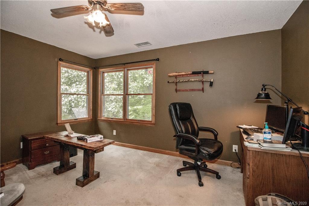 8869 Holdsclaw Road Terrell, NC 28682 - Photo 22 of 37 a view of a workspace with furniture and a window