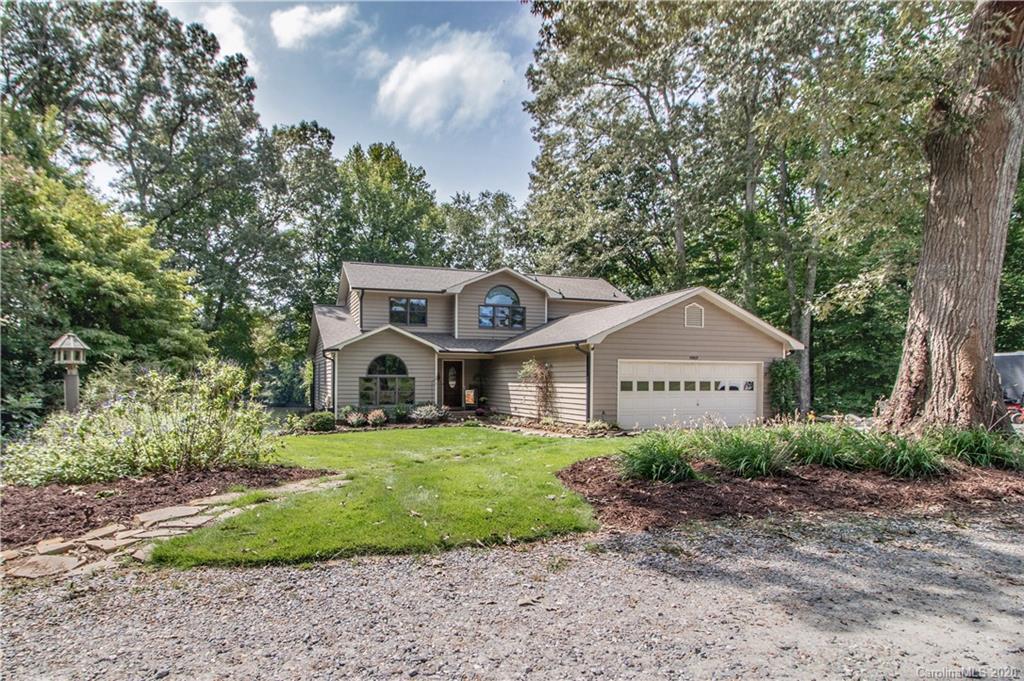 8869 Holdsclaw Road Terrell, NC 28682 - Photo 29 of 37 a front view of a house with a yard and large trees