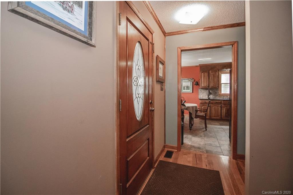 8869 Holdsclaw Road Terrell, NC 28682 - Photo 8 of 37 a view of a hallway and a livingroom with furniture