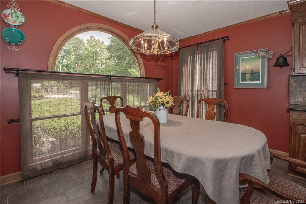 8869 Holdsclaw Road Terrell, NC 28682 - Photo 9 of 37 a view of a dining room with furniture window and outside view