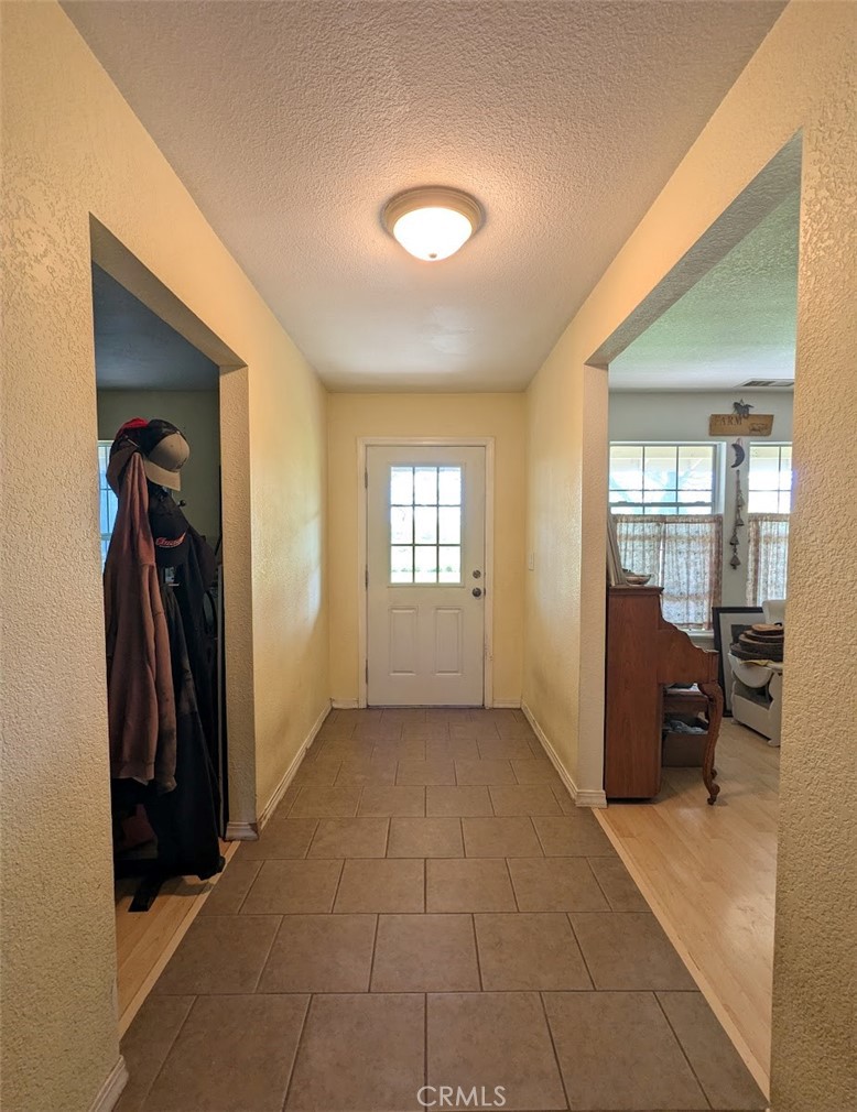 2304 Hutton Way Durham, CA 95938 - Photo 14 of 43 a view of a hallway with furniture and a bathroom