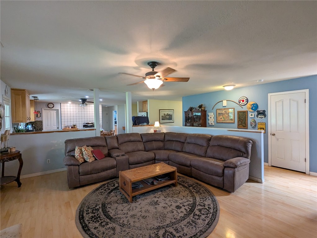 2304 Hutton Way Durham, CA 95938 - Photo 23 of 43 a living room with furniture and a chandelier
