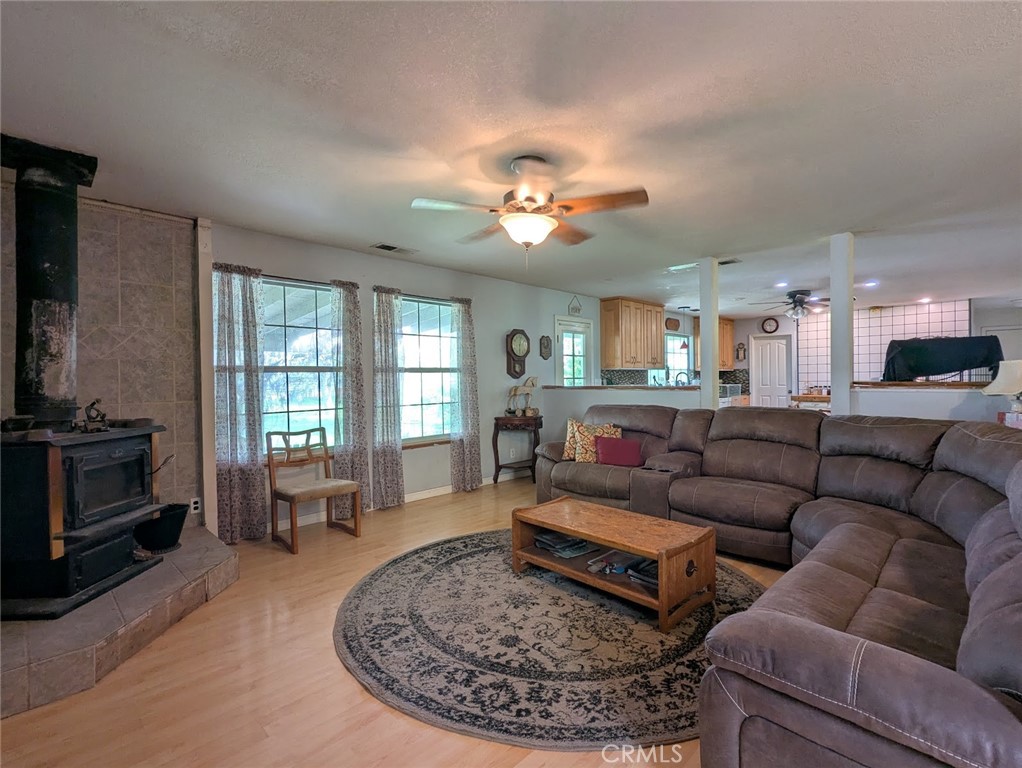 2304 Hutton Way Durham, CA 95938 - Photo 24 of 43 a living room with furniture and a fireplace