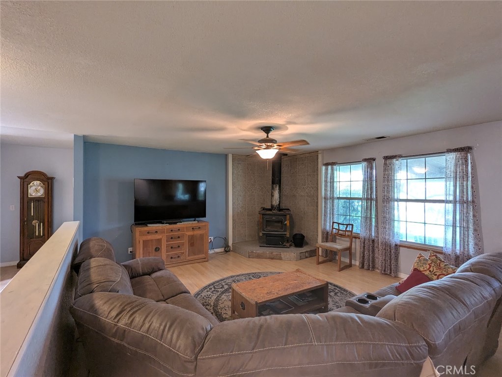 2304 Hutton Way Durham, CA 95938 - Photo 25 of 43 a living room with furniture and a flat screen tv
