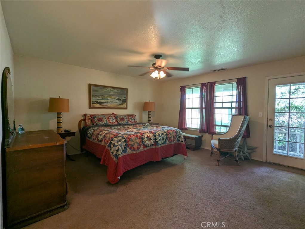 2304 Hutton Way Durham, CA 95938 - Photo 27 of 43 a bedroom with a bed chair and a window