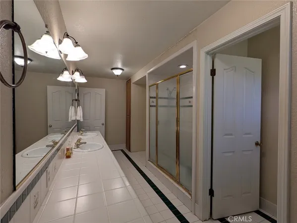 a view of an entryway with wooden floor and mirror