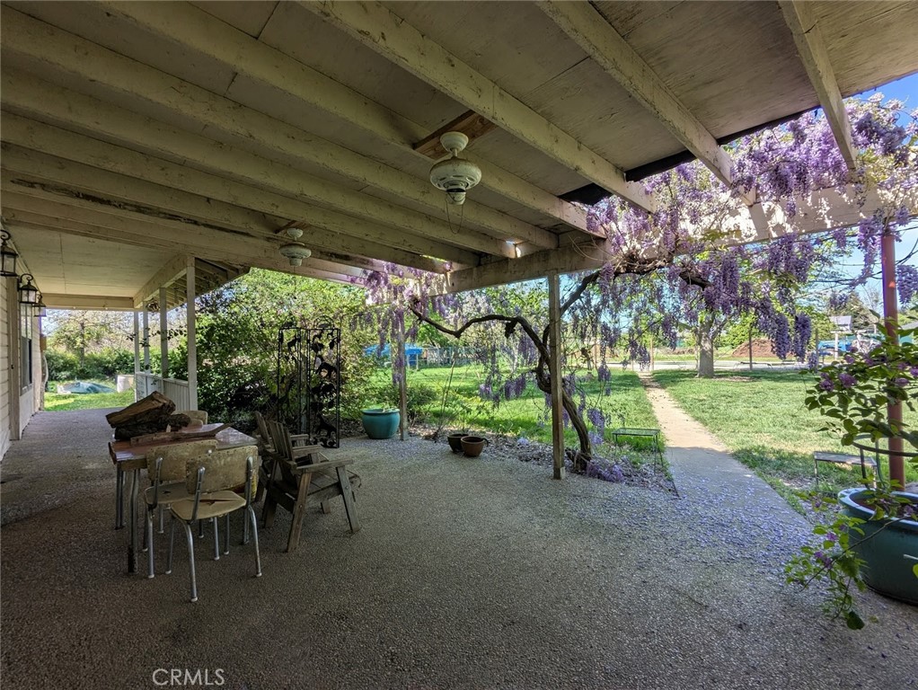 2304 Hutton Way Durham, CA 95938 - Photo 34 of 43 a view of a porch with chairs and a yard