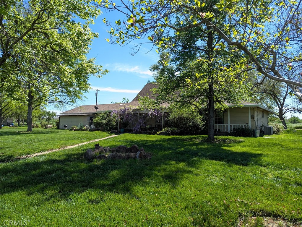 2304 Hutton Way Durham, CA 95938 - Photo 41 of 43 a view of a house with a big yard potted plants and a large tree