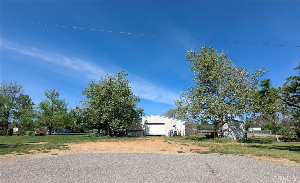 2304 Hutton Way Durham, CA 95938 - Photo 42 of 43 a view of a street with a building and trees in the background