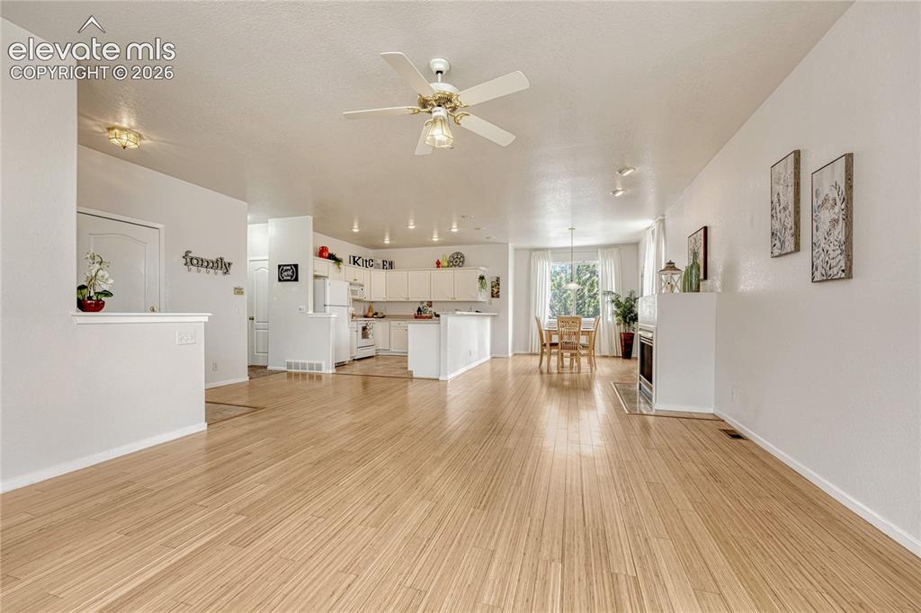 7285 Julynn Road Colorado Springs, CO 80919 - Photo 7 of 45 a view of a living room and wooden floor