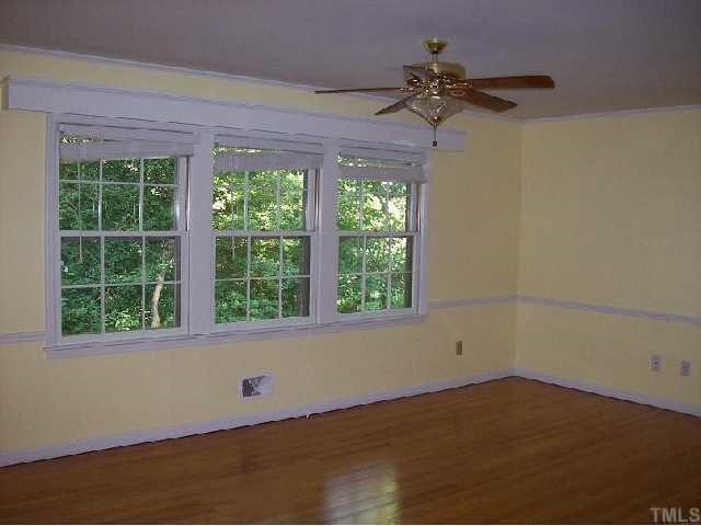 4810 Oak Park Road Raleigh, NC 27612 - Photo 5 of 12 Family room with masonary fireplace & hardwoods