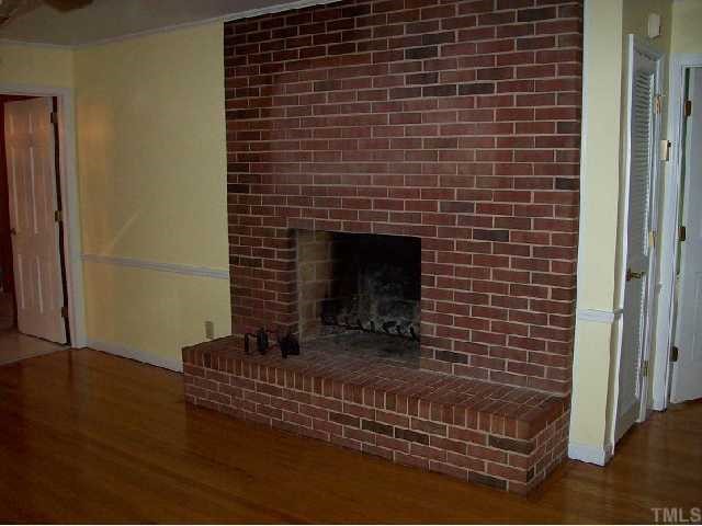 4810 Oak Park Road Raleigh, NC 27612 - Photo 6 of 12 Family room fireplace goes down to the basement bonus room fireplace
