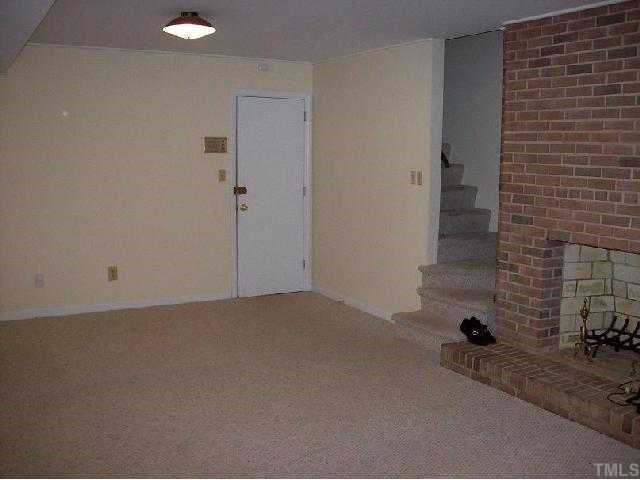 4810 Oak Park Road Raleigh, NC 27612 - Photo 10 of 12 Bonus room in basement with access to the outside patio and garage/shop