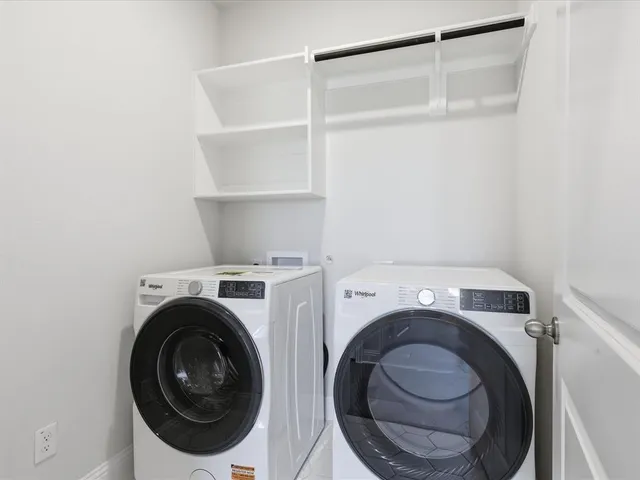 a view of a living room with a hallway