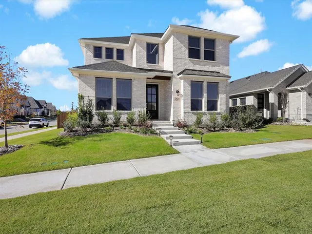 a view of a building with a yard