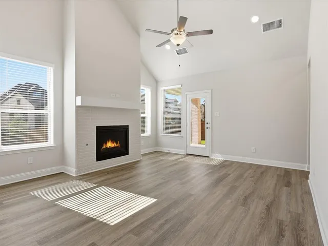a kitchen with a sink a counter space and a ceiling fan