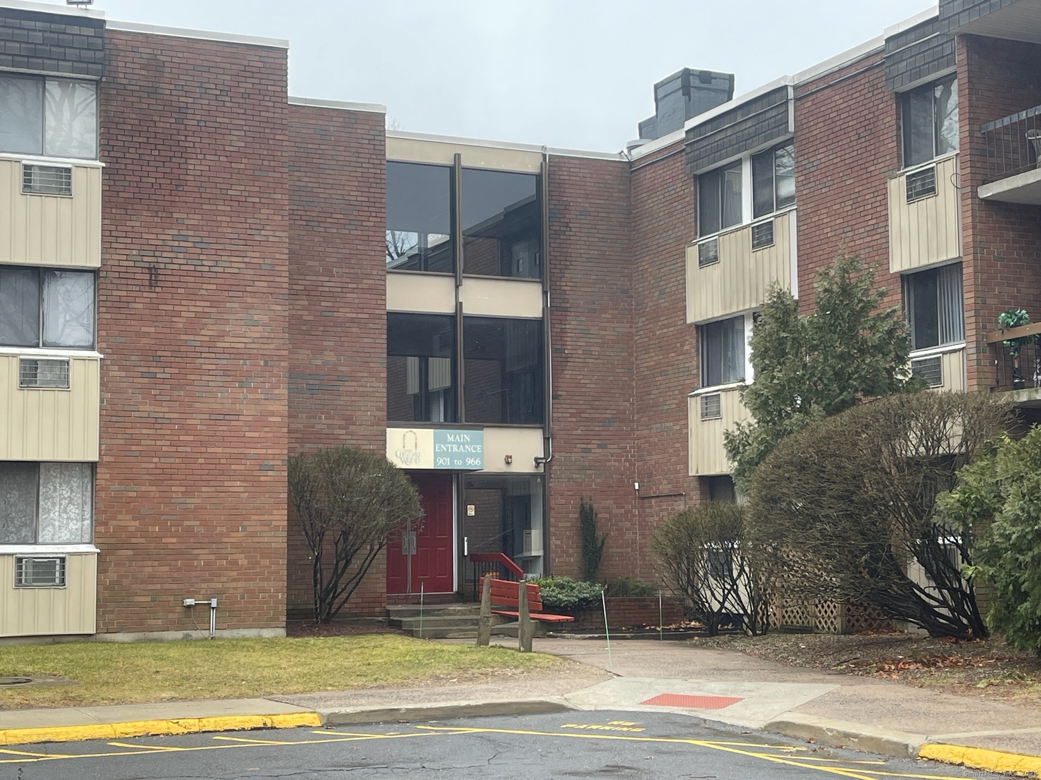 a view of a brick building with many windows