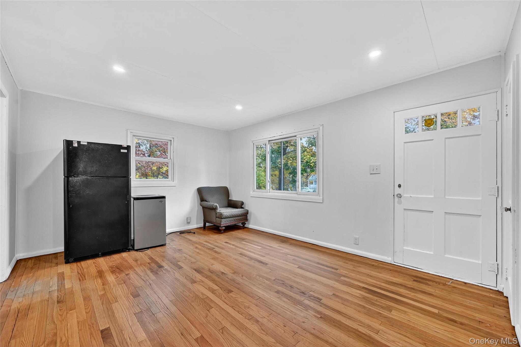 106 East Eckerson Road Spring Valley, NY 10977 - Photo 12 of 33 a view of empty room with wooden floor and window