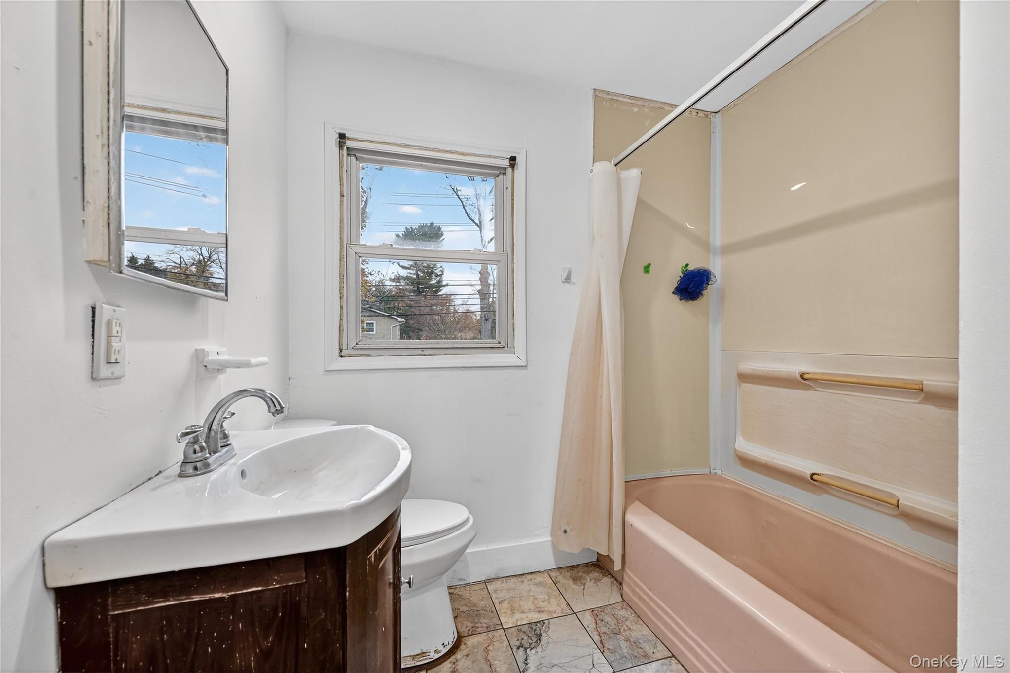 106 East Eckerson Road Spring Valley, NY 10977 - Photo 14 of 33 a bathroom with a sink and a mirror