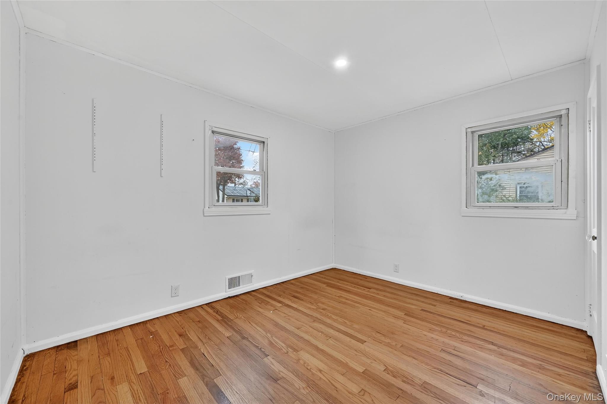 106 East Eckerson Road Spring Valley, NY 10977 - Photo 17 of 33 a view of empty room with wooden floor