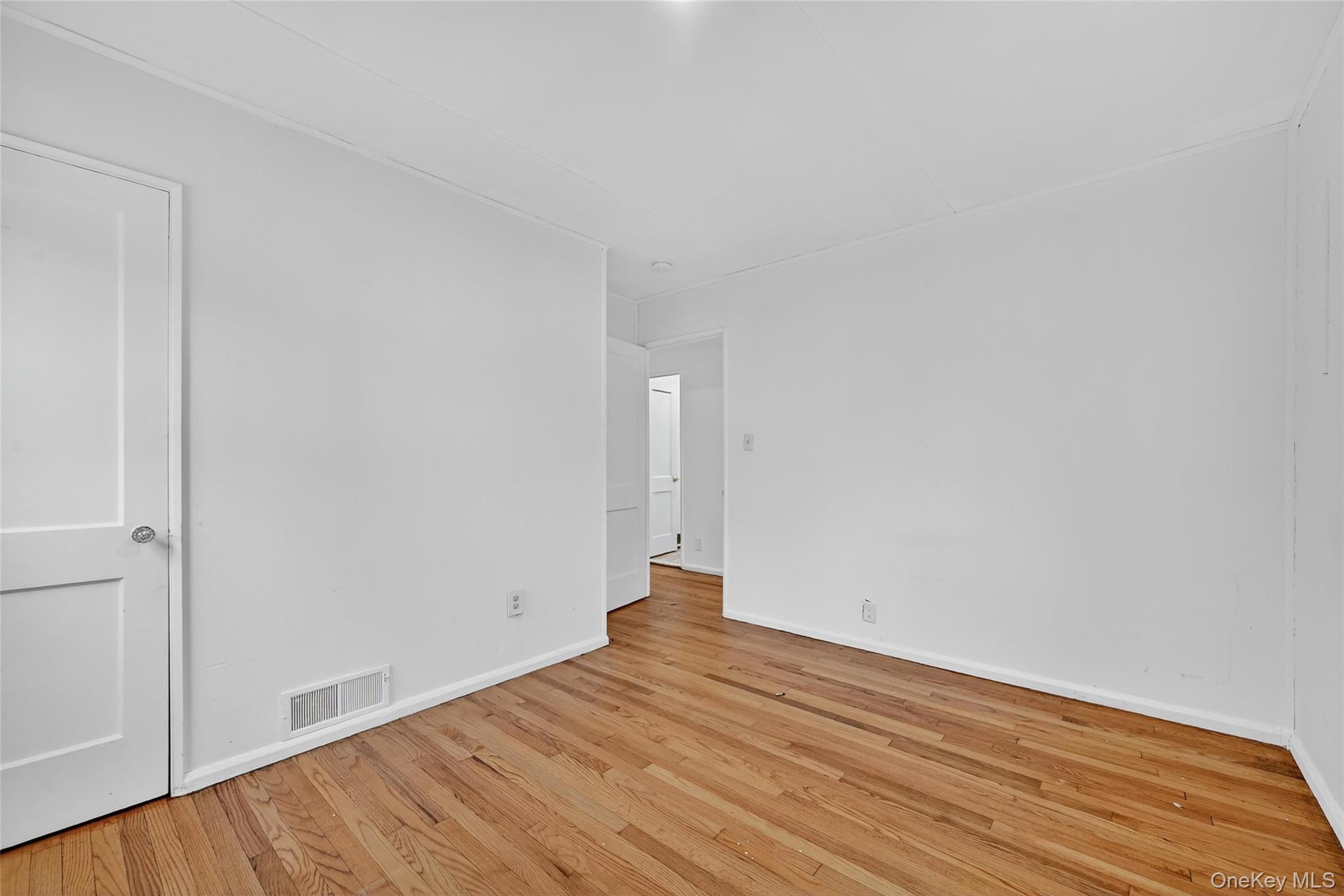 106 East Eckerson Road Spring Valley, NY 10977 - Photo 19 of 33 a view of empty room with wooden floor