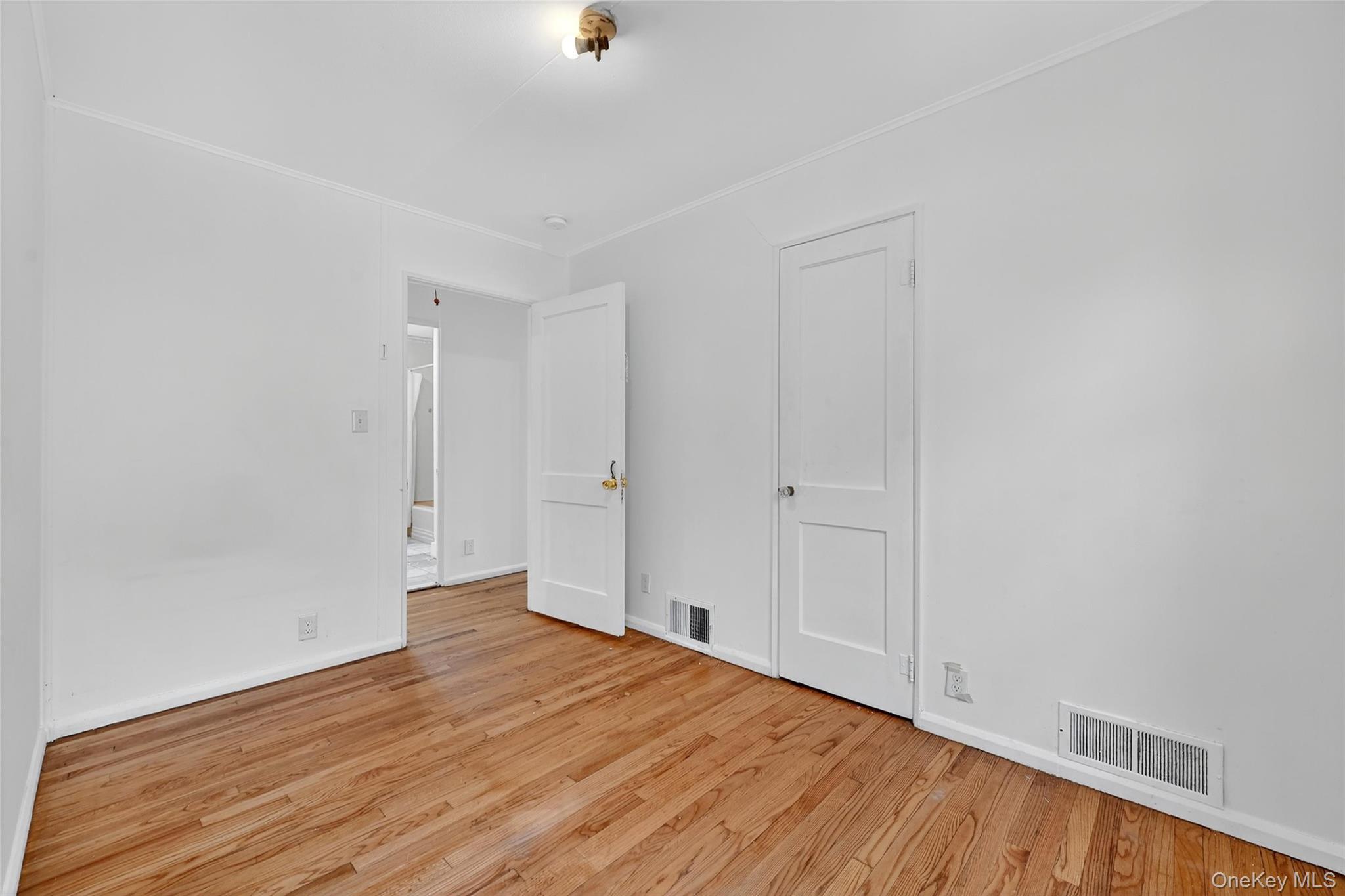 106 East Eckerson Road Spring Valley, NY 10977 - Photo 22 of 33 a view of an empty room and wooden floor