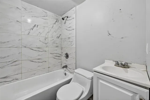 a bathroom with a sink toilet and bathtub