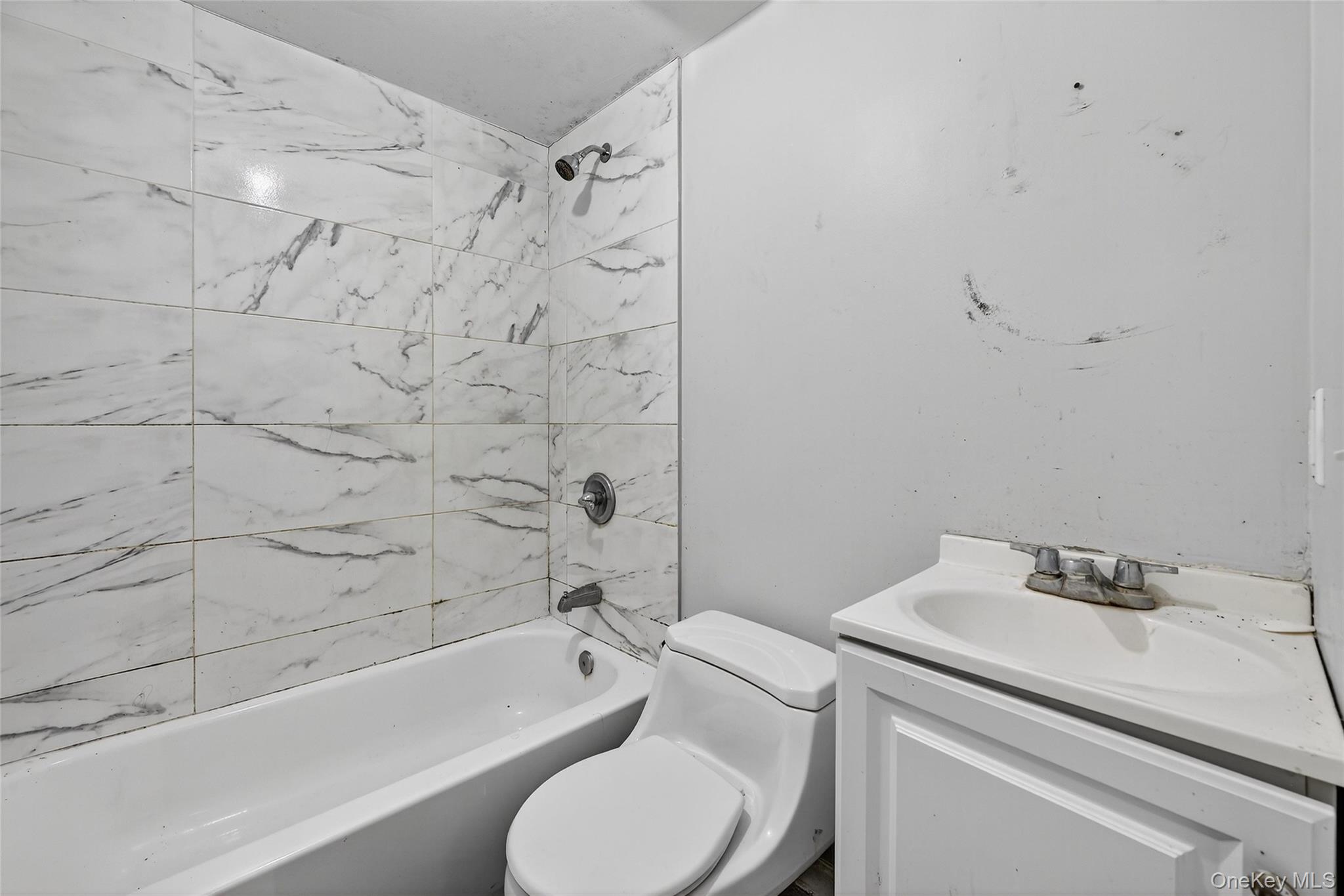 106 East Eckerson Road Spring Valley, NY 10977 - Photo 28 of 33 a bathroom with a sink toilet and bathtub