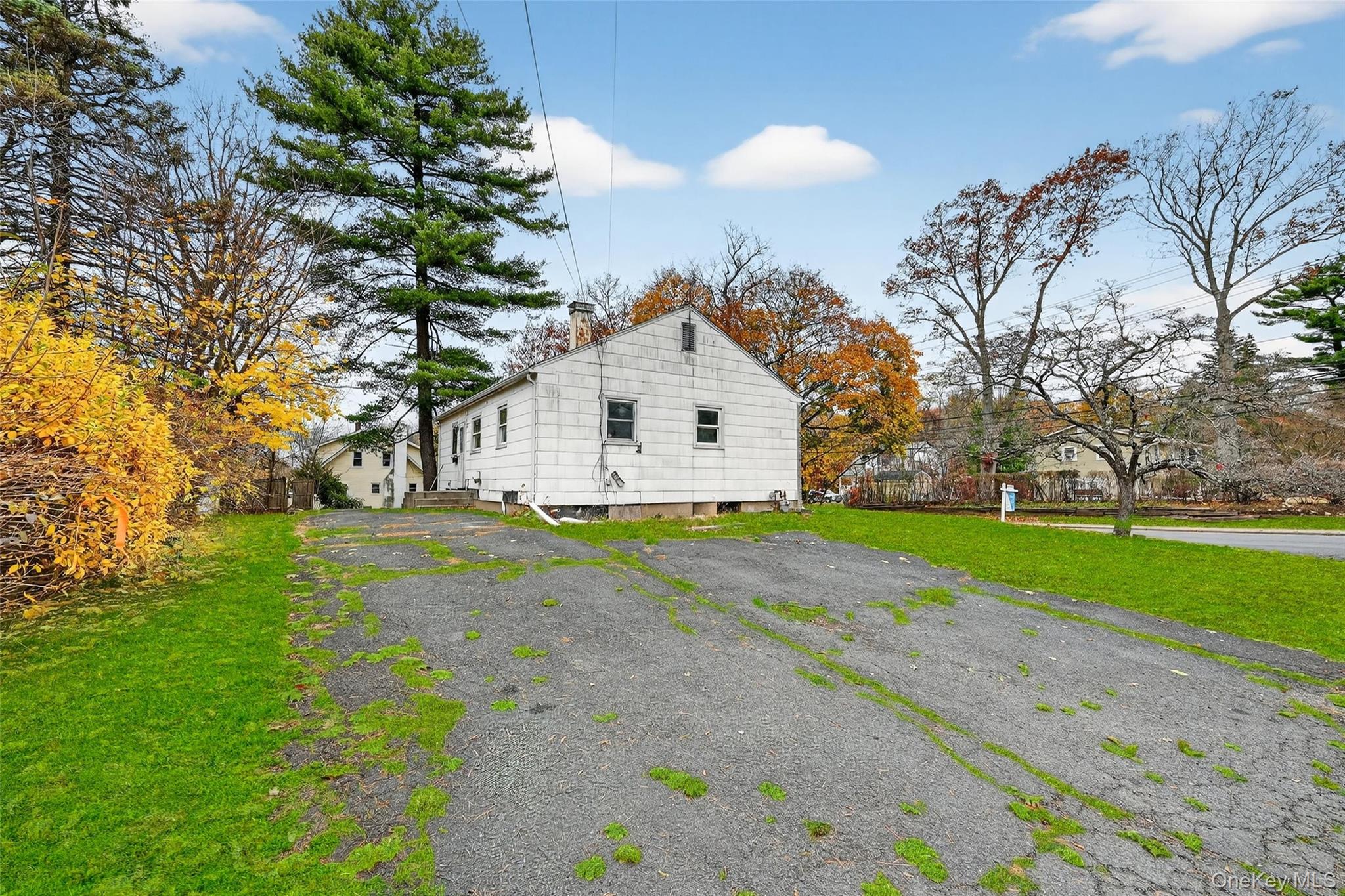106 East Eckerson Road Spring Valley, NY 10977 - Photo 32 of 33 a view of a white house with a big yard and large trees