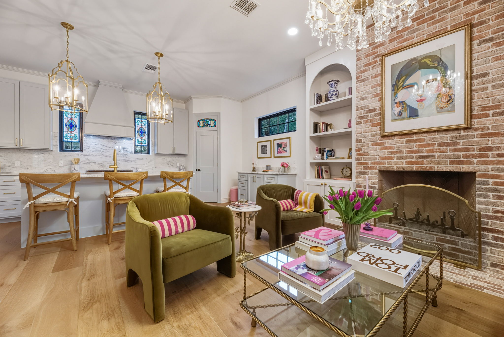 1804 South 6th Street Austin, TX 78704 - Photo 15 of 40 a living room with furniture a chandelier and a fireplace