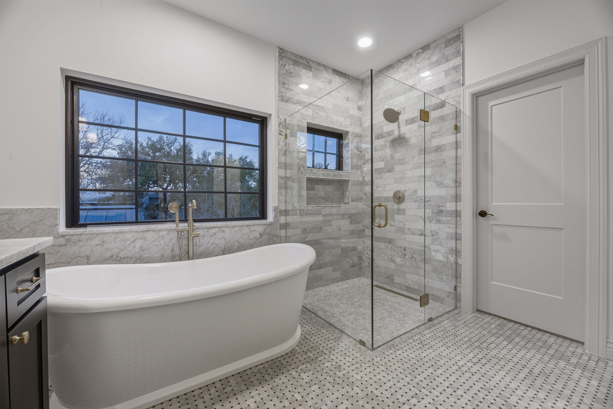 1804 South 6th Street Austin, TX 78704 - Photo 27 of 40 a bathroom with a bathtub and a shower