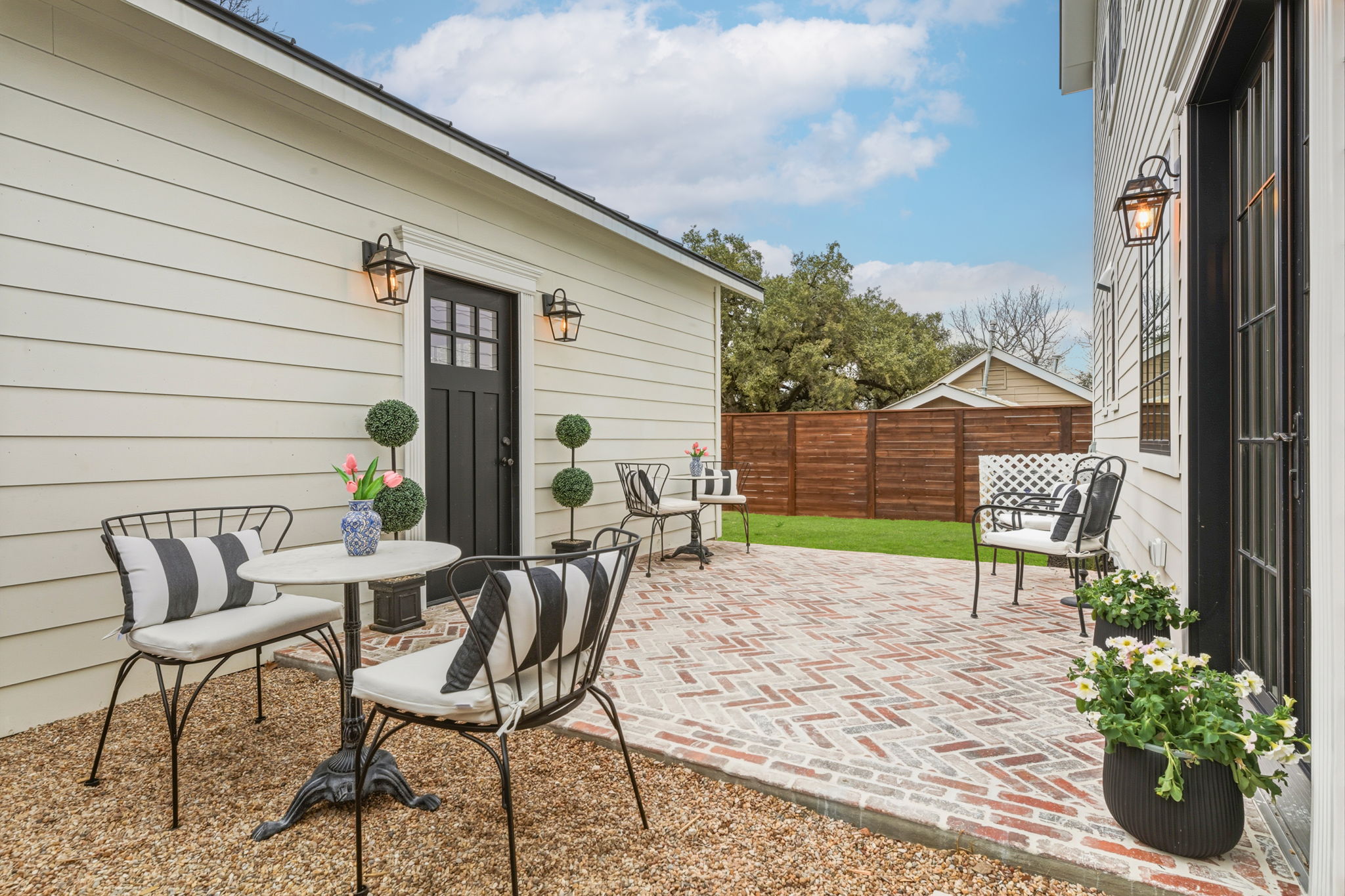 1804 South 6th Street Austin, TX 78704 - Photo 37 of 40 a view of a patio with a table and chairs and potted plants