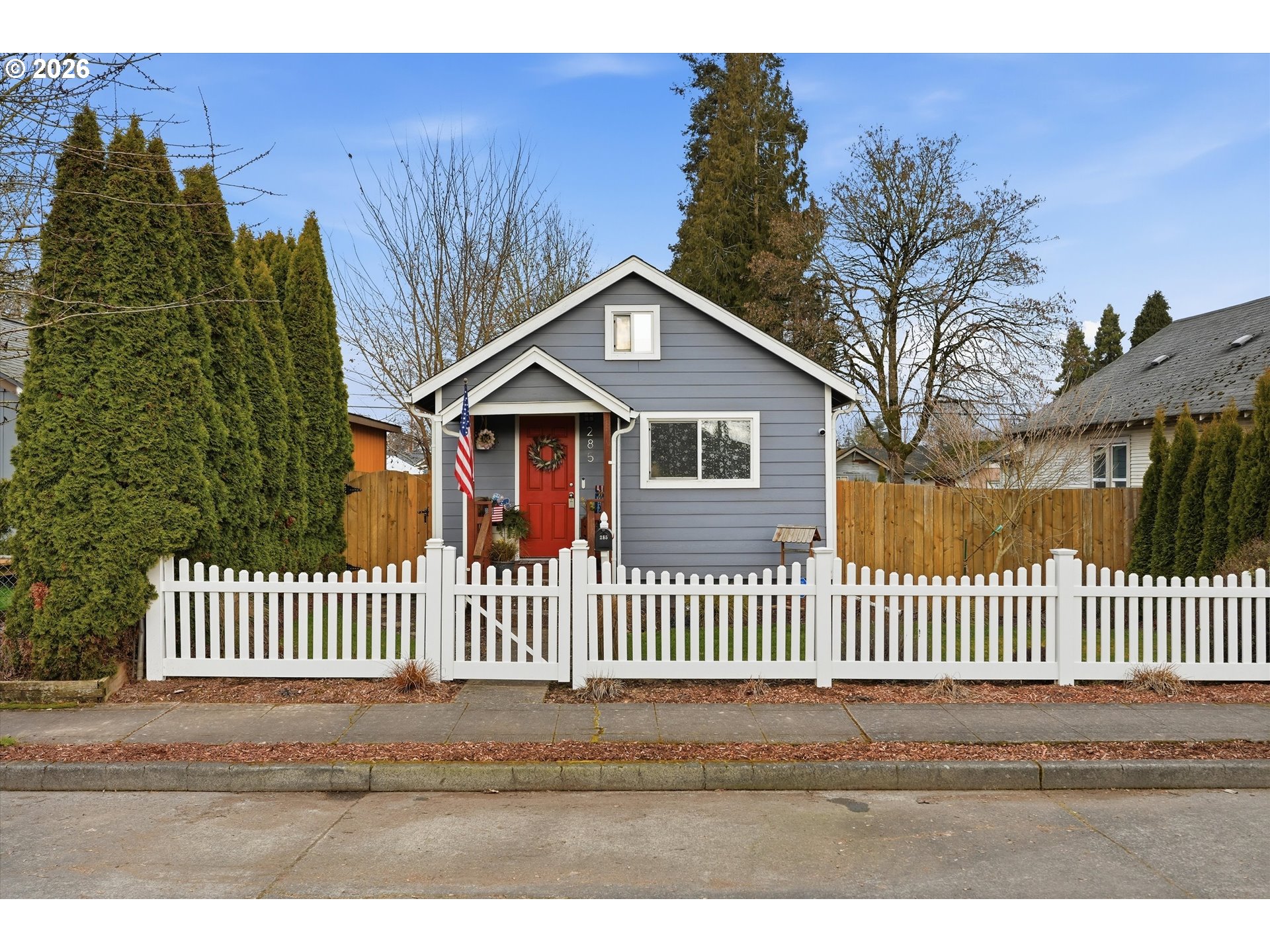 285 19th Avenue Longview, WA 98632 - Photo 2 of 27 a view of a house with a small yard and wooden fence