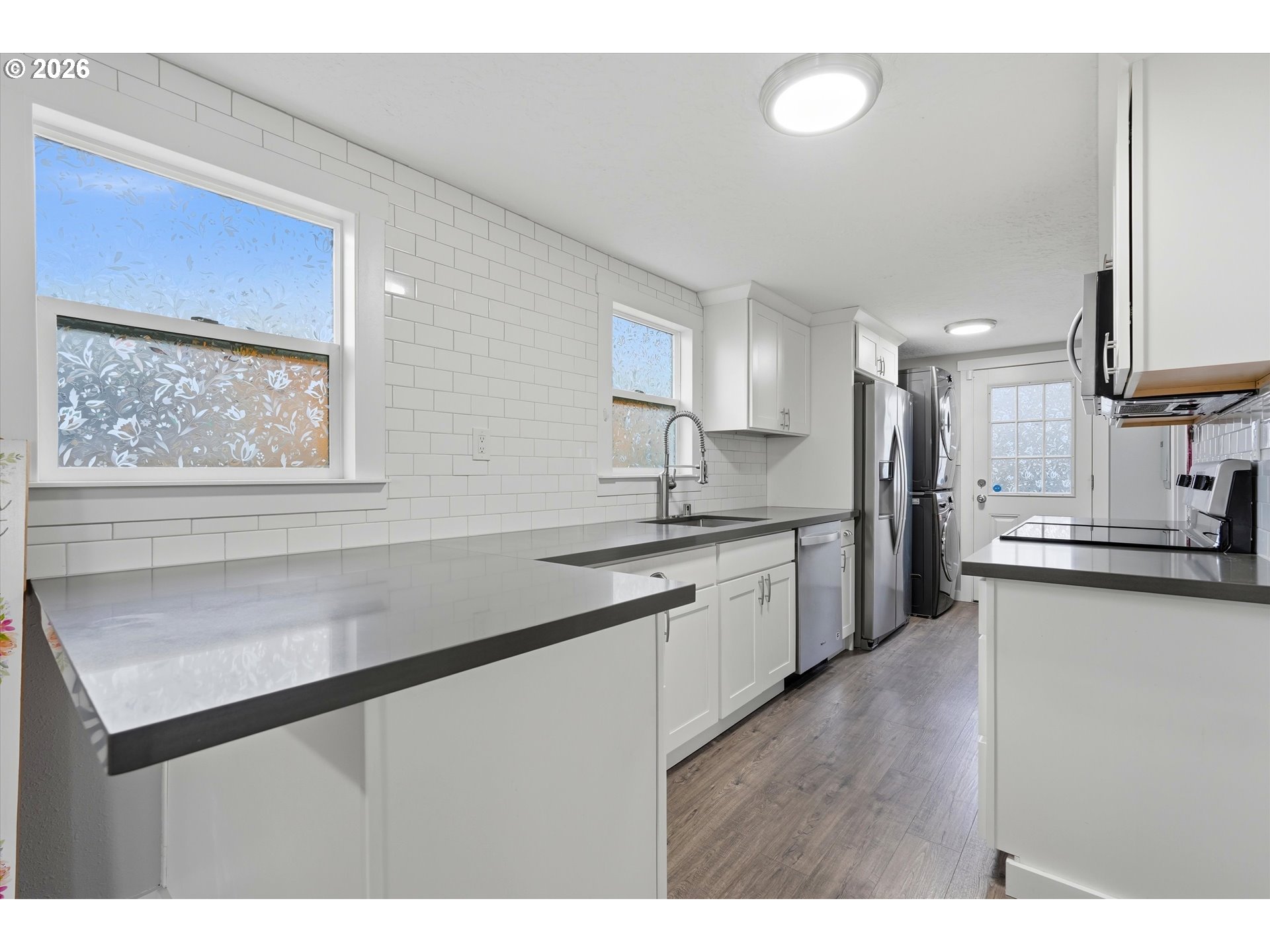 285 19th Avenue Longview, WA 98632 - Photo 10 of 27 a kitchen with stainless steel appliances granite countertop a sink a stove and a wooden cabinets