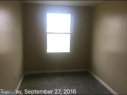 7929 Wynbrook Road Baltimore, MD 21224 - Photo 7 of 10 a view of an empty room with a window